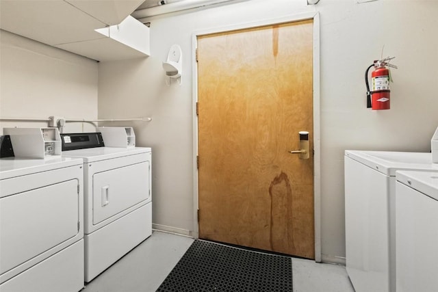 common laundry area featuring washing machine and dryer
