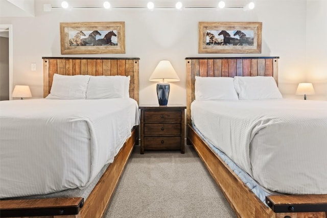 bedroom with light carpet