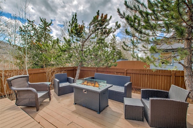 116 Blue Grouse Ln, Silverthorne, CO 80498 - wooden deck with a fenced backyard and an outdoor living space with a fire pit