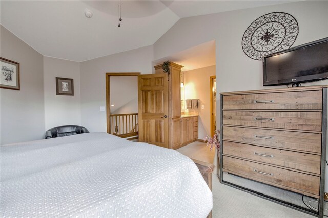 116 Blue Grouse Ln, Silverthorne, CO 80498 - bedroom featuring lofted ceiling, light colored carpet, and ensuite bath