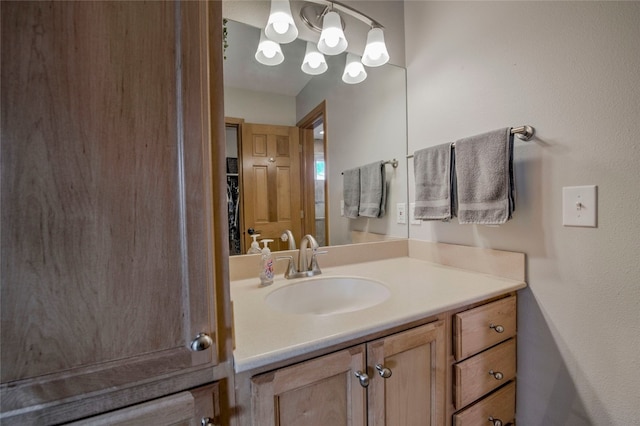 116 Blue Grouse Ln, Silverthorne, CO 80498 - bathroom with vanity and a chandelier