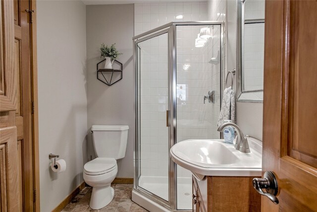 116 Blue Grouse Ln, Silverthorne, CO 80498 - full bathroom with toilet, a shower stall, baseboards, and vanity