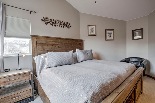 116 Blue Grouse Ln, Silverthorne, CO 80498 - bedroom with light colored carpet, vaulted ceiling, and baseboards