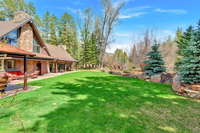 44 Maverick Way, Silverthorne, CO 80498 - view of green lawn with a patio and outdoor lounge area