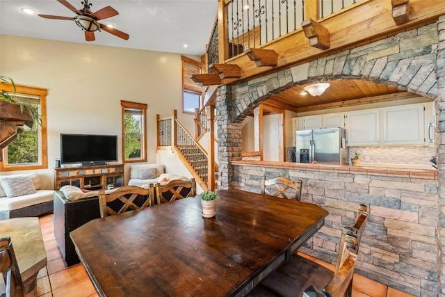 471 Mountain Vista Cir Unit 1, Steamboat Springs, CO 80487 - dining area featuring stairway, a ceiling fan, light tile patterned flooring, plenty of natural light, and wood ceiling