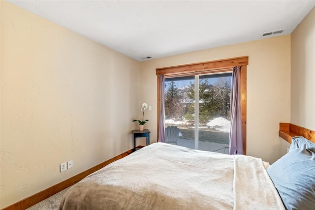 471 Mountain Vista Cir Unit 1, Steamboat Springs, CO 80487 - bedroom featuring carpet and access to outside