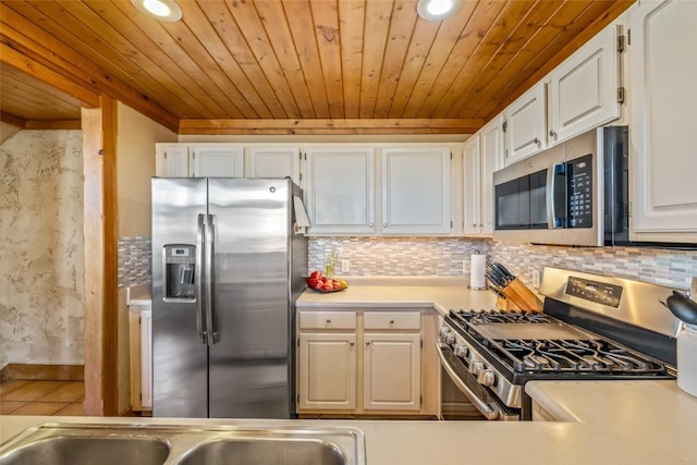 471 Mountain Vista Cir Unit 1, Steamboat Springs, CO 80487 - kitchen featuring appliances with stainless steel finishes, wood ceiling, light countertops, recessed lighting, and decorative backsplash