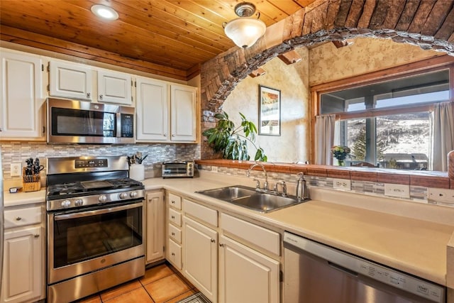471 Mountain Vista Cir Unit 1, Steamboat Springs, CO 80487 - kitchen featuring stainless steel appliances, wood ceiling, light countertops, backsplash, and recessed lighting