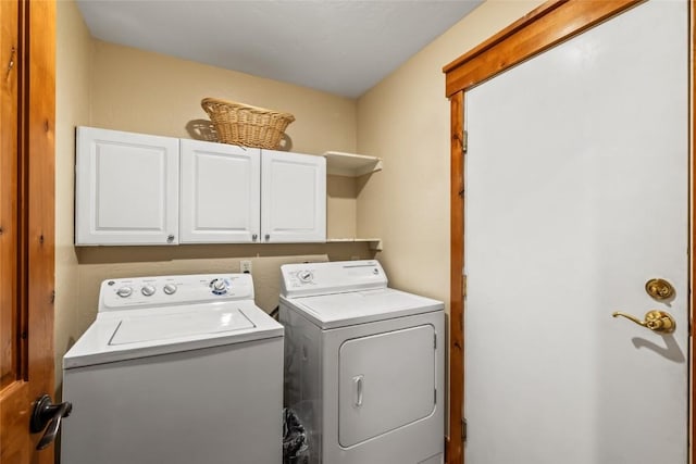 471 Mountain Vista Cir Unit 1, Steamboat Springs, CO 80487 - washroom featuring washer and clothes dryer and cabinet space