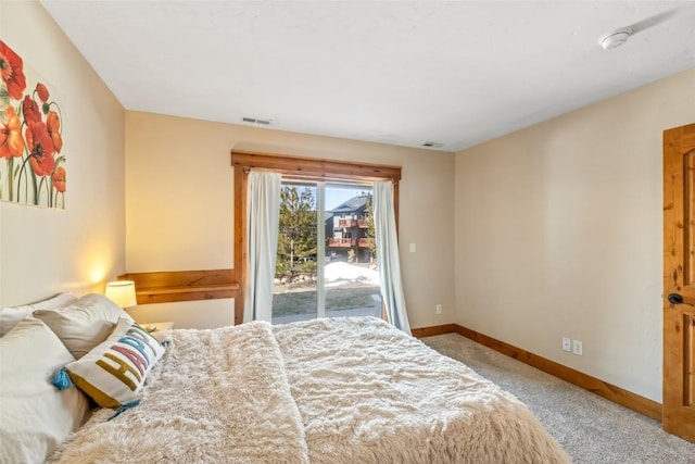 471 Mountain Vista Cir Unit 1, Steamboat Springs, CO 80487 - carpeted bedroom featuring access to outside and baseboards