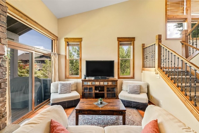 471 Mountain Vista Cir Unit 1, Steamboat Springs, CO 80487 - living room with plenty of natural light, stairs, and wood finished floors