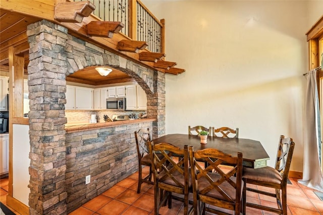 471 Mountain Vista Cir Unit 1, Steamboat Springs, CO 80487 - dining room with light tile patterned floors and arched walkways