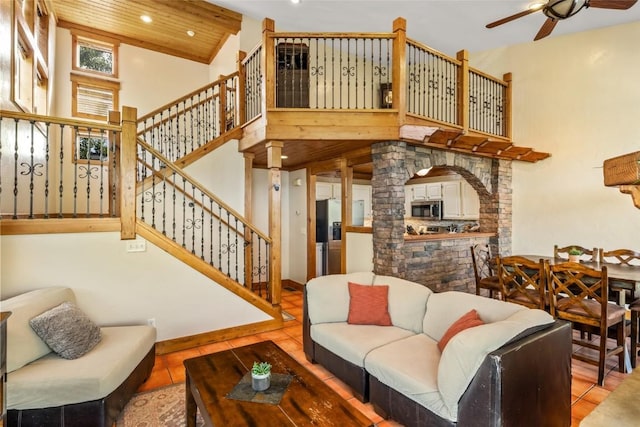 471 Mountain Vista Cir Unit 1, Steamboat Springs, CO 80487 - living area featuring tile patterned floors, a ceiling fan, stairway, recessed lighting, and high vaulted ceiling