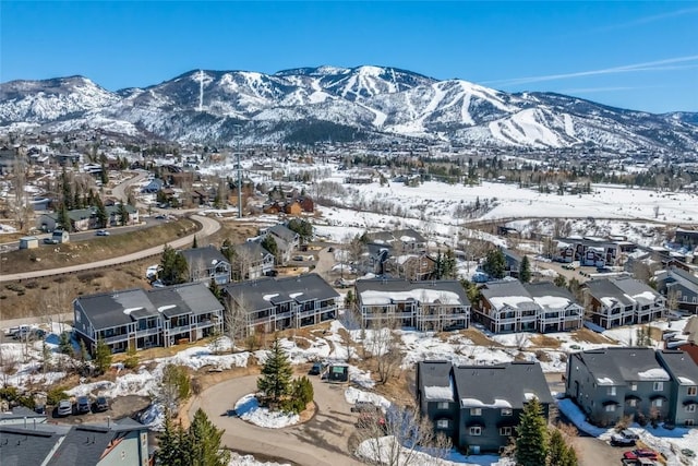 471 Mountain Vista Cir Unit 1, Steamboat Springs, CO 80487 - snowy aerial view with a mountain view and a residential view
