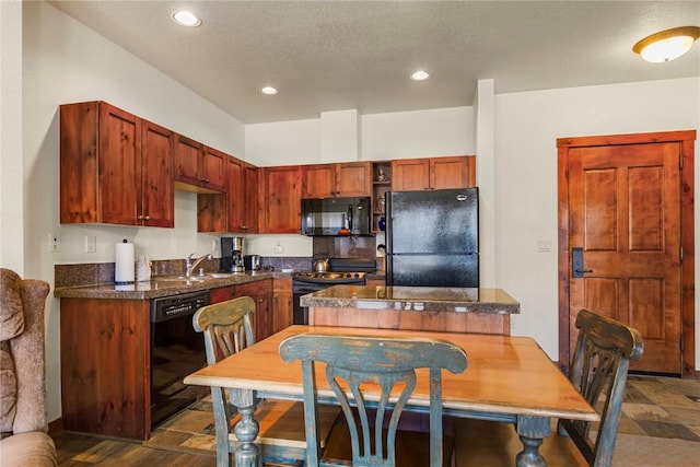505 S Main St Unit 2305, Breckenridge, CO 80424 - kitchen featuring black appliances, dark countertops, recessed lighting, and a sink