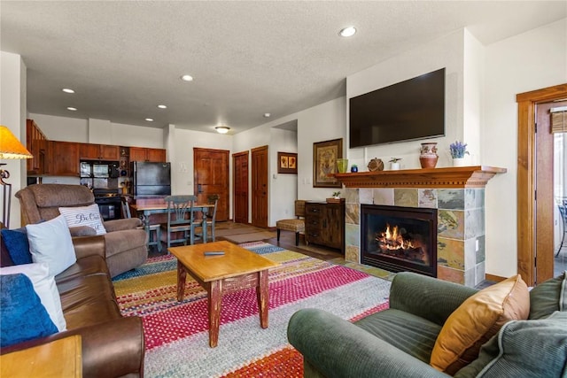 505 S Main St Unit 2305, Breckenridge, CO 80424 - living room featuring recessed lighting, a fireplace, and a textured ceiling
