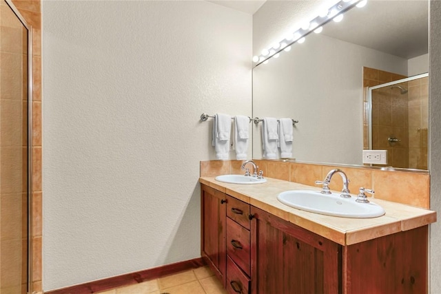 505 S Main St Unit 2305, Breckenridge, CO 80424 - full bathroom featuring a stall shower, tile patterned flooring, double vanity, a textured wall, and baseboards