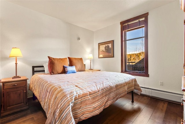 505 S Main St Unit 2305, Breckenridge, CO 80424 - bedroom featuring a baseboard heating unit and dark wood-type flooring