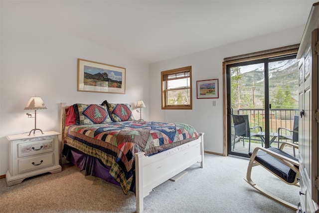 400 Bayview Dr Unit D, Frisco, CO 80443 - bedroom featuring light colored carpet, access to outside, and baseboards