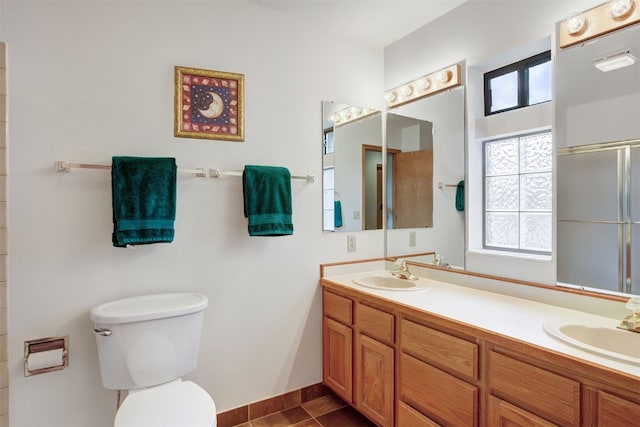 400 Bayview Dr Unit D, Frisco, CO 80443 - full bathroom with toilet, double vanity, an enclosed shower, tile patterned flooring, and baseboards