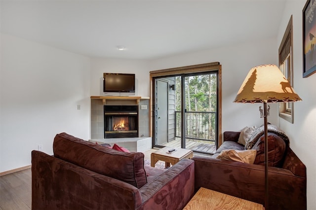 400 Bayview Dr Unit D, Frisco, CO 80443 - living room with a tiled fireplace and wood finished floors