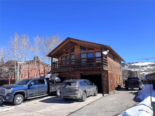 exterior space featuring driveway and an attached garage