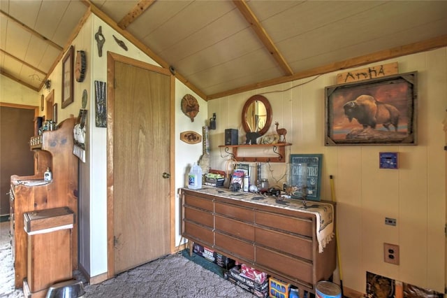 misc room featuring vaulted ceiling, wooden ceiling, and carpet