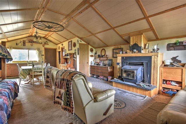carpeted living area with a wood stove and lofted ceiling with beams