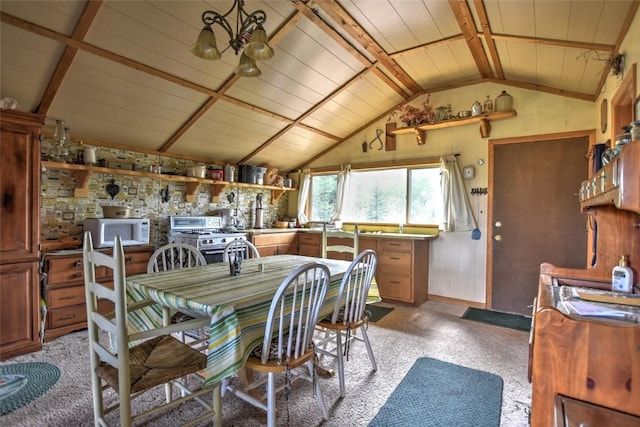 dining space with lofted ceiling and wooden ceiling