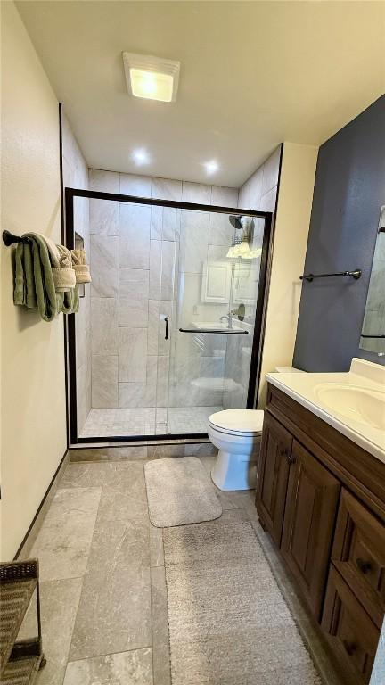 9430 Ryan Gulch Rd Unit 9453, Silverthorne, CO 80498 - bathroom with toilet, a shower stall, and vanity