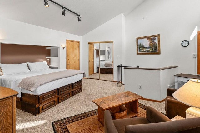 9430 Ryan Gulch Rd Unit 9453, Silverthorne, CO 80498 - bedroom featuring carpet floors, rail lighting, baseboards, and high vaulted ceiling