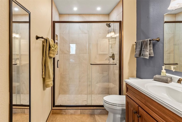 9430 Ryan Gulch Rd Unit 9453, Silverthorne, CO 80498 - full bathroom with toilet, vanity, a shower stall, and recessed lighting