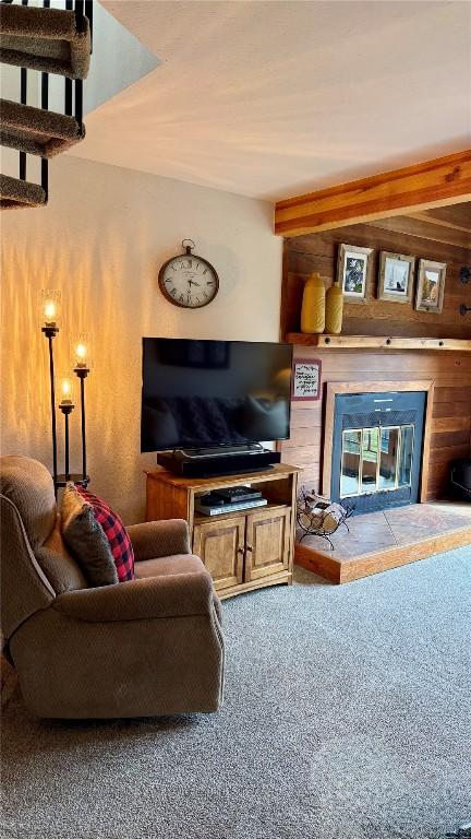 9430 Ryan Gulch Rd Unit 9453, Silverthorne, CO 80498 - living area with carpet floors, a multi sided fireplace, and wooden walls