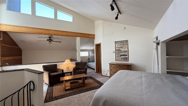 9430 Ryan Gulch Rd Unit 9453, Silverthorne, CO 80498 - carpeted bedroom featuring multiple windows, track lighting, ceiling fan, and high vaulted ceiling