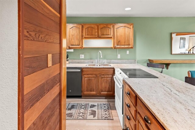 9430 Ryan Gulch Rd Unit 9453, Silverthorne, CO 80498 - kitchen featuring a sink, electric range, stainless steel dishwasher, light wood-style floors, and open shelves