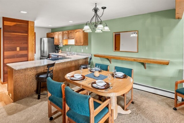 9430 Ryan Gulch Rd Unit 9453, Silverthorne, CO 80498 - dining space with light colored carpet, recessed lighting, and a baseboard heating unit