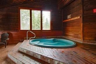 9430 Ryan Gulch Rd Unit 9453, Silverthorne, CO 80498 - miscellaneous room with a jacuzzi and wood walls