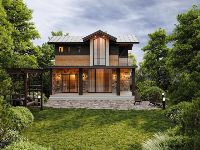 TBD Deerfoot Ave, Steamboat Springs, CO 80487 - back of house featuring a yard, stone siding, a standing seam roof, and a patio