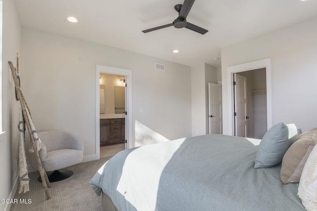 carpeted bedroom with connected bathroom, recessed lighting, a ceiling fan, and visible vents