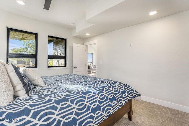 carpeted bedroom featuring baseboards, a ceiling fan, and recessed lighting
