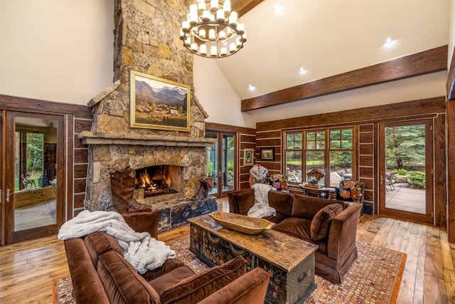 215 Royal Tiger Rd, Breckenridge, CO 80424 - living area with a chandelier, high vaulted ceiling, light wood finished floors, a fireplace, and beam ceiling