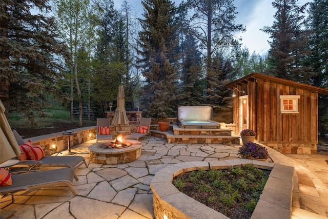 215 Royal Tiger Rd, Breckenridge, CO 80424 - view of patio / terrace with an outdoor fire pit and an outbuilding