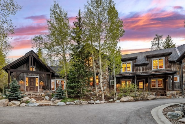 215 Royal Tiger Rd, Breckenridge, CO 80424 - view of front of home featuring covered porch, roof with shingles, and stone siding