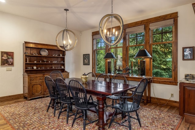 215 Royal Tiger Rd, Breckenridge, CO 80424 - dining space featuring a chandelier and wood finished floors