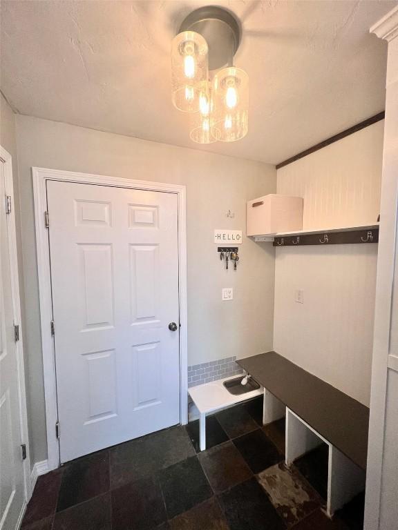 158 Oak Ridge Cir, Oak Creek, CO 80467 - mudroom with a chandelier