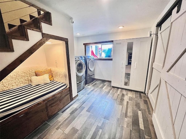 158 Oak Ridge Cir, Oak Creek, CO 80467 - laundry room with wood finished floors, separate washer and dryer, and recessed lighting