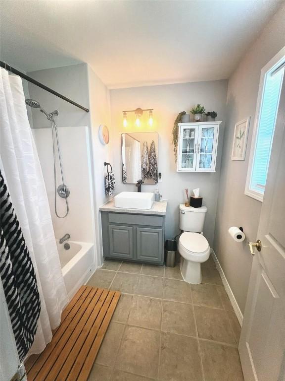 158 Oak Ridge Cir, Oak Creek, CO 80467 - full bathroom with vanity, toilet, tile patterned flooring, shower / bath combo, and baseboards