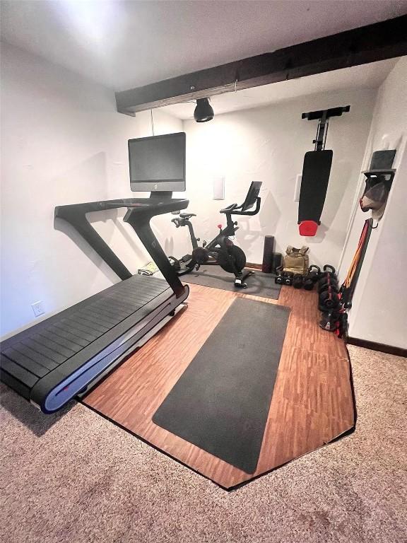 158 Oak Ridge Cir, Oak Creek, CO 80467 - workout room featuring carpet and baseboards