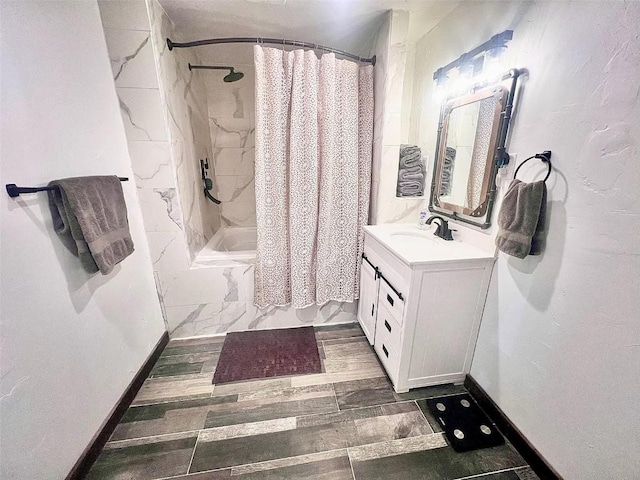 158 Oak Ridge Cir, Oak Creek, CO 80467 - full bathroom featuring vanity, shower / bathtub combination with curtain, baseboards, and wood finished floors