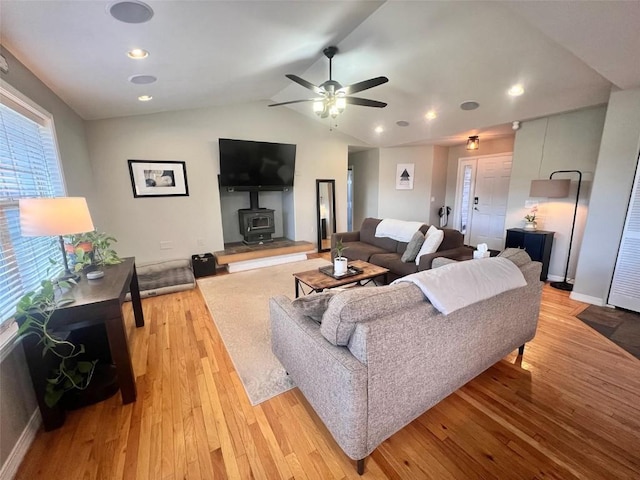 158 Oak Ridge Cir, Oak Creek, CO 80467 - living area with light wood finished floors, ceiling fan, vaulted ceiling, and a wood stove